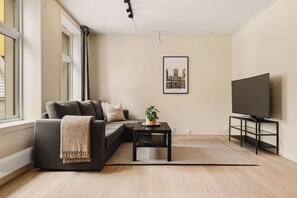 The comfortable sofa and smart TV are perfect for a cozy day indoors, especially during Bergen's rainy days.