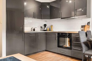 kitchen featuring stainless steel appliances, plenty of counter space