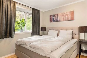 Serene bedroom featuring a comfortable bed, soft linens