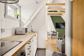 Open-plan living room flowing into the kitchen and dining space.