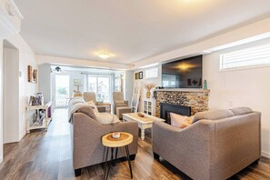 Cozy living room, gas fireplace, and 60" tv.