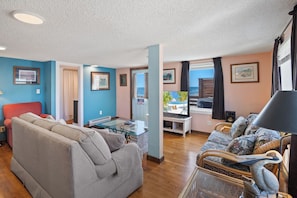 Relax in the spacious Living Area with a Flat Screen TV and beautiful ocean views!