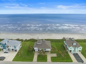 The house is just steps from the beach, only a one-minute walk away
