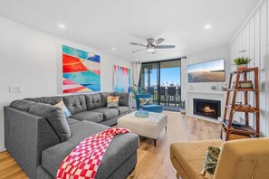 Cozy up by the fireplace in our spacious living area for those cooler coastal evenings