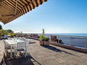 Plant, Water, Sky, Property, Table, Flowerpot, Chair, Seaside Resort, Outdoor Furniture, Building
