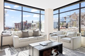 Enjoy the comfortable couch in the living room while watching TV and enjoying the beautiful views.