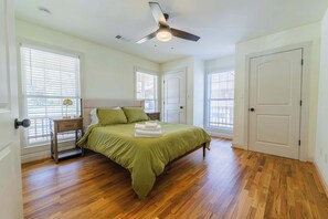 Sink into comfort in our serene bedroom featuring a cozy queen-sized bed. Perfect for a restful night's sleep after a day of exploring. Book your relaxing escape today! 🛌

