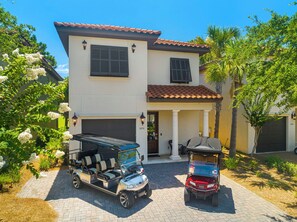 Front of Home & Two Golf Carts