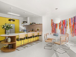 Open layout with counter or dining table seating.