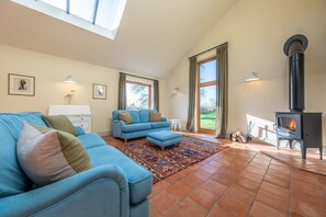 Mill Hill, Tittleshall Barns: Sitting room with wood burning stove