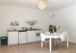 The kitchen and dining area of the living space