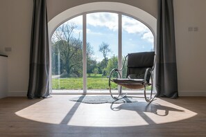 Views over the countryside and private lake from the cottage's living space