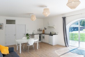 The kitchen and dining area of the open-plan living