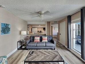 Living Room - Balcony Access, Fireplace + TV