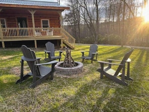 Wood burning firepit with 4 adirondak chairs and wood supplied