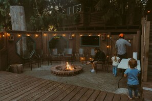 Cozy up by the enclosed fire pit and make some s'mores together.
