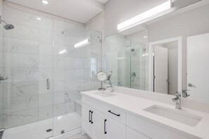 Master ensuite with large shower, sit down bench and double sinks. Hairdryer, makeup mirror included with your stay!