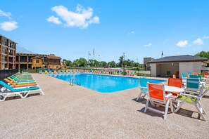 Seasonal Outdoor Pool  with plenty of Lounge Chairs, Restrooms, Lift Assist Chair