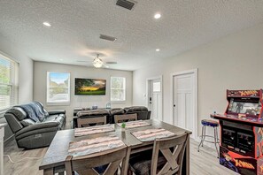 Living Area with power recliners, smart TV, xbox, Full-size arcade game (Xmen, Captain America)