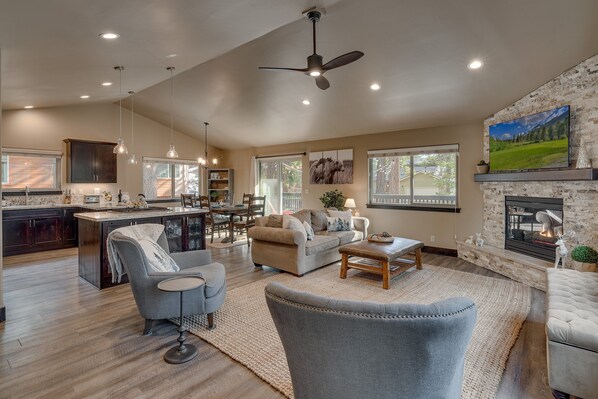 Living area with sectional sofa, flat screen TV and fireplace