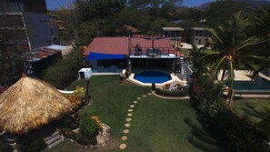 View from the ocean facing back to the house from a drone photo.