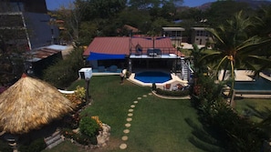 View from the ocean facing back to the house from a drone photo.