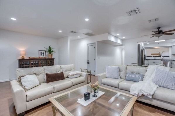 Front living room with leather sofas