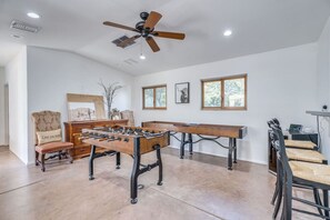 Game room with bar and mini fridge