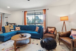 Eclectic living room with leather wing chairs 