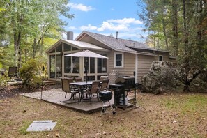 Outdoor dining porch with Gas and Charcoal grills