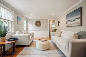 Cozy up after a day of adventures, where our living room welcomes you to plop down, snuggle up and take in the views of our quaint neighborhood!