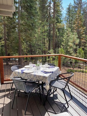 A spacious front deck offers outdoor seating to entertain, dine, or relax while enjoying the views.