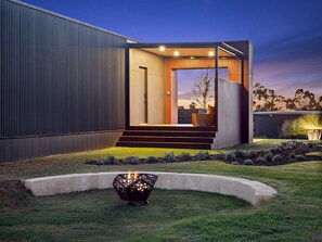 The backyard offers a fire pit to cosy up around in the cooler months.