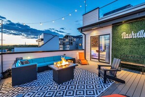 Relax in your Downtown Nashville rooftop oasis! Enjoy skyline views and cocktails in this stylish retreat, perfect for large groups and bachelorette parties. With chic seating and a cozy fire pit, it's ideal for memorable nights under the stars. Make this luxurious getaway your base for exploring Music City!