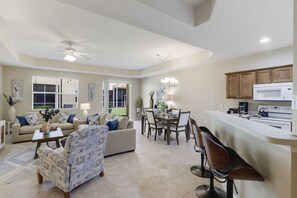 Large living room with ample seating and vaulted ceilings