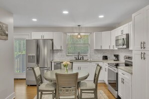 Fully equipped kitchen | Dining area | Direct access to back yard