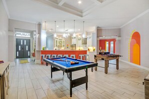 Enjoy endless entertainment with a billiard table and foosball table.