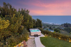Hot tub with a view of the coast.