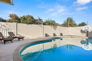 Private backyard with an outdoor pool!