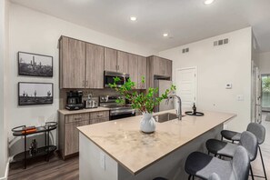 Modern and Functional Kitchen with Island Seating for Four