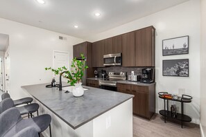 Modern and Functional Kitchen with Island Seating for Four
