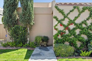 Front entrance with climbing vines.