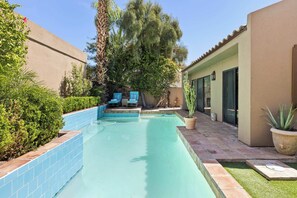 Lush landscaping around the pool.