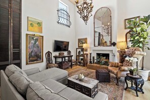 Comfy seating by the TV and fireplace.