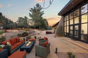 Gather and unwind by the warmth of the firepit under starlit skies.
