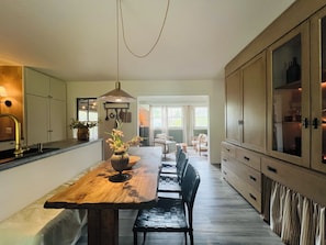 Artisan made, live edge, wood dining table with comfy banquette seating