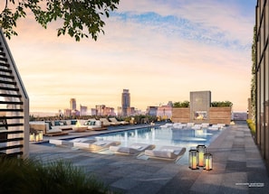 Watching the sunrise from this rooftop pool is a whole vibe. Can't beat this city view.