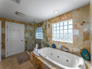 Master bathroom with tub and shower