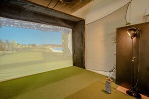Immersive golf experience awaits.  A simulated course unfolds on the screen, promising hours of precision practice.⛳️ #GolfSimulator