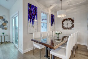 Dining room includes custom table with seating for ten